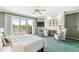 Main bedroom features a fireplace, sliding glass door to a deck, and serene lake views at 3748 Bay Rd S Dr, Indianapolis, IN 46240