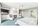 Large primary bedroom with a fireplace, sitting area, and a neutral color scheme at 3748 Bay Rd S Dr, Indianapolis, IN 46240