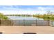 Lake view from the spacious wooden deck of this home with railing overlooking a calm lake on a sunny day at 3748 Bay Rd S Dr, Indianapolis, IN 46240