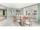 Dining room with an oval table and chairs, neutral carpet, and decorative wall mirror at 3748 Bay Rd S Dr, Indianapolis, IN 46240