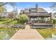 Lovely view of a home and lake from a private wooden dock at 3748 Bay Rd S Dr, Indianapolis, IN 46240