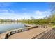 Inviting wooden dock overlooking a picturesque, calm lake, perfect for relaxing and enjoying waterfront activities at 3748 Bay Rd S Dr, Indianapolis, IN 46240