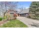 Charming home with a brick exterior, three-car garage, and beautiful landscaping at 3748 Bay Rd S Dr, Indianapolis, IN 46240