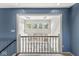 Upstairs hallway with stairs leading to first floor at 3748 Bay Rd S Dr, Indianapolis, IN 46240