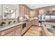 Modern kitchen with granite countertops, tile backsplash, and stainless steel appliances at 3748 Bay Rd S Dr, Indianapolis, IN 46240