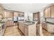 Open kitchen with granite counters, stainless steel appliances, and a large central island at 3748 Bay Rd S Dr, Indianapolis, IN 46240