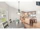 Open-concept kitchen and dining area boasts hardwood floors and stainless steel appliances at 3748 Bay Rd S Dr, Indianapolis, IN 46240