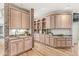 Gourmet kitchen with custom cabinets, granite countertops, and hardwood flooring at 3748 Bay Rd S Dr, Indianapolis, IN 46240