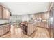 Spacious kitchen with a center island, dining area, and high-end stainless steel appliances at 3748 Bay Rd S Dr, Indianapolis, IN 46240
