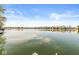 Scenic view of the lake under a bright sky, showing its calm waters and lush shoreline, promoting peaceful living at 3748 Bay Rd S Dr, Indianapolis, IN 46240