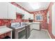 Well-equipped laundry room with modern washer/dryer, storage cabinets, and a utility sink at 3748 Bay Rd S Dr, Indianapolis, IN 46240