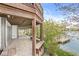 Covered patio featuring scenic lake views and a private dock, ideal for outdoor relaxation and entertainment at 3748 Bay Rd S Dr, Indianapolis, IN 46240