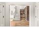 A view of the carpeted staircase leading to upper levels and a decorative brick wall at 3748 Bay Rd S Dr, Indianapolis, IN 46240