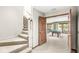 View of carpeted staircase leading to a game room with a billiards table and water view at 3748 Bay Rd S Dr, Indianapolis, IN 46240