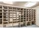 Large storage room featuring custom wood shelving, plank walls and ceiling with recessed lighting at 3748 Bay Rd S Dr, Indianapolis, IN 46240