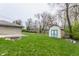 View of backyard featuring green grass and a shed at 3959 N Grant Ave, Indianapolis, IN 46226