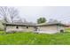 Expansive backyard featuring a concrete patio, offering plenty of room for outdoor activities and landscaping opportunities at 3959 N Grant Ave, Indianapolis, IN 46226
