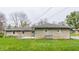 Spacious backyard with a well-maintained lawn and concrete patio, perfect for outdoor gatherings and relaxation at 3959 N Grant Ave, Indianapolis, IN 46226