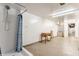 Partially finished basement area featuring a shower, walls painted in white, and concrete floors at 3959 N Grant Ave, Indianapolis, IN 46226