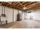 Unfinished basement with concrete floor, a sink, and utilities at 3959 N Grant Ave, Indianapolis, IN 46226