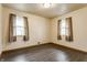 The bedroom has hardwood floors, natural light, and a window with curtains at 3959 N Grant Ave, Indianapolis, IN 46226