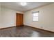 The empty bedroom includes a window for natural light, plus hardwood floors and a closet at 3959 N Grant Ave, Indianapolis, IN 46226