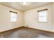 Bedroom featuring hardwood flooring and two windows offering natural light at 3959 N Grant Ave, Indianapolis, IN 46226