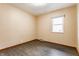 Bedroom featuring hardwood flooring and a window offering natural light at 3959 N Grant Ave, Indianapolis, IN 46226