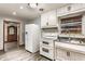 Well-lit kitchen with stainless steel sink and a view to the next room at 3959 N Grant Ave, Indianapolis, IN 46226