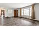 Bright living room with hardwood floors, neutral walls, and large window offering ample natural light at 3959 N Grant Ave, Indianapolis, IN 46226