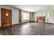 Inviting living room with a cozy fireplace, large windows and elegant hardwood floors throughout at 3959 N Grant Ave, Indianapolis, IN 46226