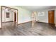Open-concept living area featuring hardwood floors, neutral walls, and seamless transitions to other rooms at 3959 N Grant Ave, Indianapolis, IN 46226