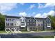 Inviting townhomes featuring distinct color schemes, complementary shutters, and manicured landscaping at 4144 Cupertino Ave # 38F, Plainfield, IN 46168