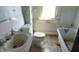 Bathroom with a toilet, sink and bathtub at 437 Jefferson Ave, Indianapolis, IN 46201