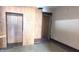 Bedroom with wood paneling, closet, overhead lighting, and vintage-style carpeting at 437 Jefferson Ave, Indianapolis, IN 46201