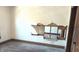 A hole in the wall exposes exposed lath in an unfurnished room at 437 Jefferson Ave, Indianapolis, IN 46201