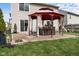 Backyard featuring brick patio with gazebo, offering an outdoor seating area, grassy yard, and privacy at 4417 Barharbor Ct, Indianapolis, IN 46268