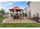 Inviting backyard featuring a brick patio with a gazebo, offering an outdoor seating and entertainment area at 4417 Barharbor Ct, Indianapolis, IN 46268