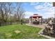 Landscaped backyard features a patio with gazebo, perfect for outdoor dining and relaxation at 4417 Barharbor Ct, Indianapolis, IN 46268