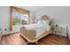 Bright bedroom featuring a statement bed frame with a large window and a classic design at 4417 Barharbor Ct, Indianapolis, IN 46268