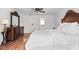 Well-lit bedroom with a view to the window, decorative furniture, and an ornate wooden bed frame at 4417 Barharbor Ct, Indianapolis, IN 46268