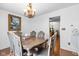 Dining room featuring hardwood floors, traditional decor and a chandelier at 4417 Barharbor Ct, Indianapolis, IN 46268
