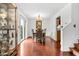 Formal dining room featuring hardwood floors, sliding door access to outside, and a classic chandelier at 4417 Barharbor Ct, Indianapolis, IN 46268