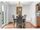 Bright dining room featuring wood floors, a traditional chandelier and elegant furnishings at 4417 Barharbor Ct, Indianapolis, IN 46268