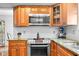 Modern kitchen featuring stainless steel appliances and granite countertops at 4417 Barharbor Ct, Indianapolis, IN 46268
