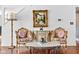 Ornate living room area featuring hardwood floors, elegant decor and a decorative cabinet at 4417 Barharbor Ct, Indianapolis, IN 46268