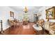 Elegant living room featuring hardwood floors, decorative furniture, large window and ample natural light at 4417 Barharbor Ct, Indianapolis, IN 46268