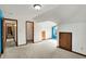 Open attic bedroom featuring multiple closets, neutral walls, and carpet flooring at 4606 Sundance Trl, Indianapolis, IN 46239