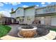 Lovely backyard with stone patio, brick firepit, and well-manicured lawn, ideal for outdoor living at 4606 Sundance Trl, Indianapolis, IN 46239