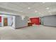 Large basement space features neutral carpet, painted walls, stairs and partial kitchen at 4606 Sundance Trl, Indianapolis, IN 46239
